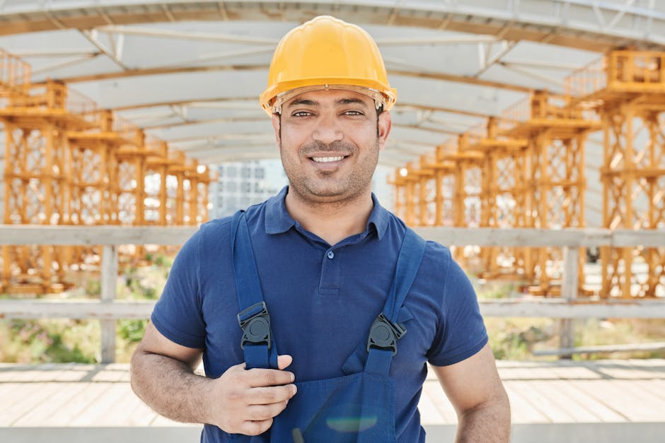 Construction professional inspecting exterior house siding and insulation layers